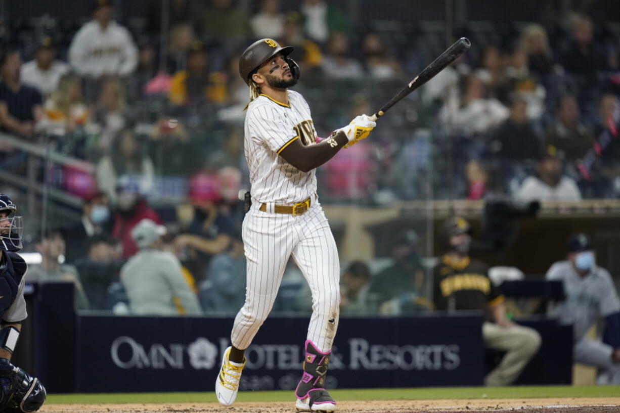 San Diego Padres' Fernando Tatis Jr. watches his three-run home run during the second inning of the team's baseball game against the Seattle Mariners, Friday, May 21, 2021, in San Diego.