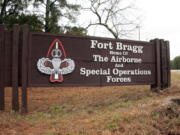 FILE - This Jan. 4, 2020 file photo shows a sign for at Fort Bragg, N.C. The push to remove Confederate names from Pentagon properties, including storied Army posts, could eventually affect hundreds of items and facilities, the chair of the congressionally chartered Naming Commission said Friday, May 21, 2021. The initial public focus was on Army bases such as Fort Bragg, North Carolina, which is named for Confederate general Braxton Bragg, and Fort Benning, Georgia, named for Brig. Gen. Henry L. Benning, who served under Lee.