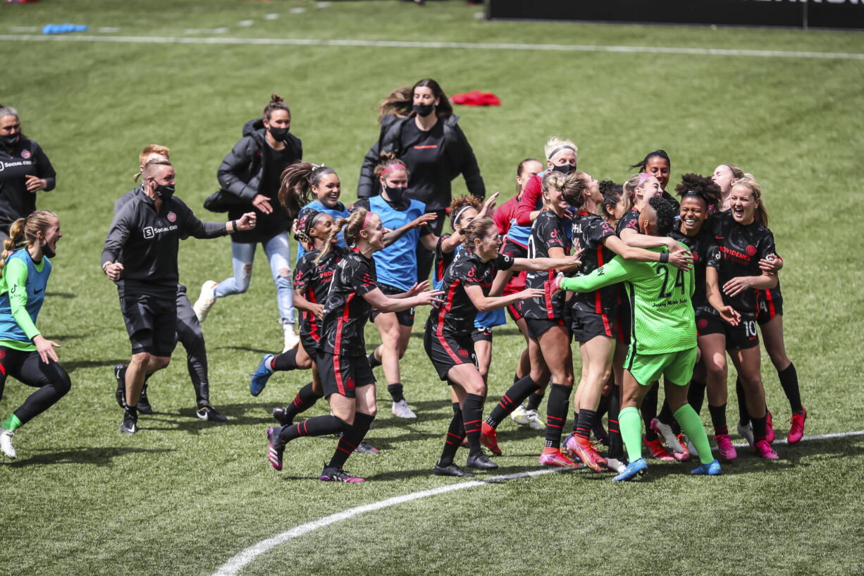 Portland Thorns goalkeeper AD Franch (24) joins the celebration after defeating NJ/NY Gotham FC in the NWSL Challenge Cup soccer final at Providence Park, Saturday, May 8, 2021, in Portland, Ore.