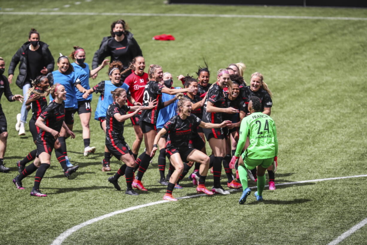 Portland Thorns goalkeeper AD Franch (24) joins the celebration after defeating NJ/NY Gotham FC in the NWSL Challenge Cup soccer final against NJ/NY Gotham FC at Providence Park, Saturday, May 8, 2021, in Portland, Ore.