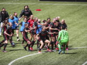 Portland Thorns goalkeeper AD Franch (24) joins the celebration after defeating NJ/NY Gotham FC in the NWSL Challenge Cup soccer final against NJ/NY Gotham FC at Providence Park, Saturday, May 8, 2021, in Portland, Ore.