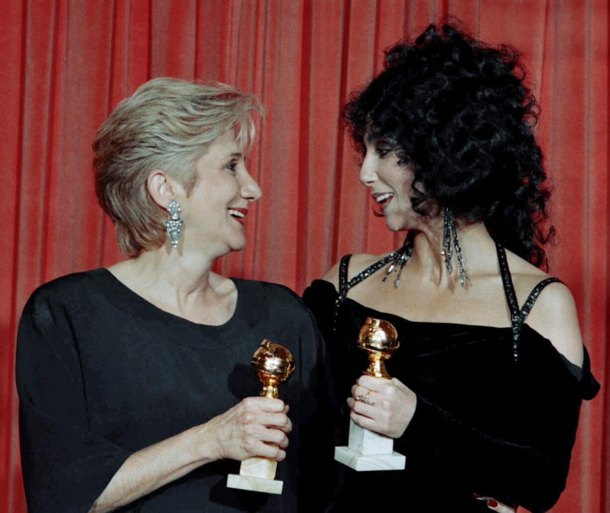 Actress Olympia Dukakis, winner of a Golden Globe for "Best Performance in a Supporting Role" and Cher, winner of the "Best Performance by an Actress in a musical or comedy", hold the awards they received for performances in the hit movie "Moonstruck" at the Beverly Hilton Hotel. Olympia Dukakis, the veteran stage and screen actress whose flair for maternal roles helped her win an Oscar as Cher's mother in the romantic comedy "Moonstruck," has died. She was 89.