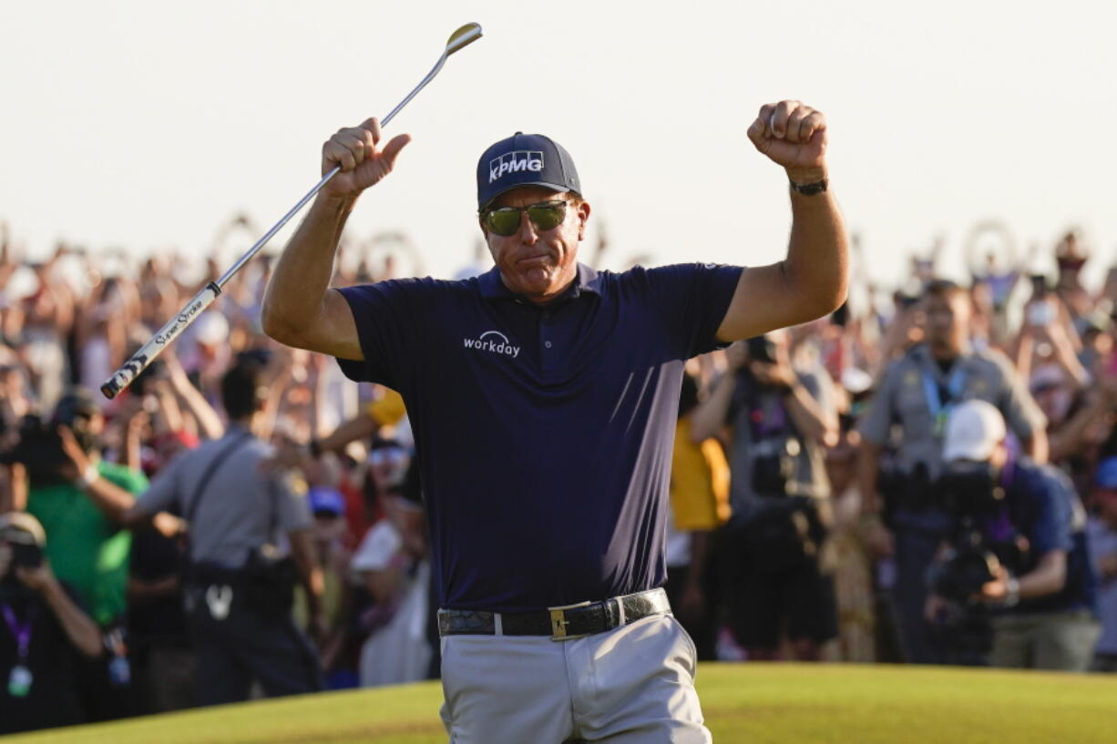 Phil Mickelson celebrates after winning the final round at the PGA Championship golf tournament on the Ocean Course, Sunday, May 23, 2021, in Kiawah Island, S.C. (AP Photo/David J.