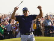 Phil Mickelson celebrates after winning the final round at the PGA Championship golf tournament on the Ocean Course, Sunday, May 23, 2021, in Kiawah Island, S.C. (AP Photo/David J.