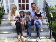 Caitrin O'Sullivan Boury, 36, left, with her husband, AJ, 35, and their four children, from left to right, Sullivan, Declyn, 5, Drew, 4, and Felicity, 2, on the steps of their home in Red Bank, N.J. on May 2. Caitrin faced challenges introducing her kids to her youngest, who was born during the pandemic.