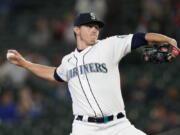 Seattle Mariners starting pitcher Chris Flexen throws to a Texas Rangers batter during the first inning of a baseball game Thursday, May 27, 2021, in Seattle.