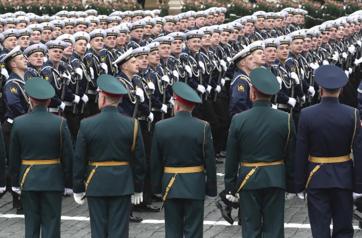 Russian sailors march toward Red Square during the Victory Day military parade in Moscow, Russia, Sunday, May 9, 2021, marking the 76th anniversary of the end of World War II in Europe.