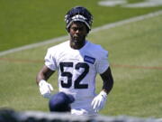 Seattle Seahawks' Darrell Taylor looks on during an NFL football rookie minicamp Friday, May 14, 2021, at the team's training facility in Renton, Wash.