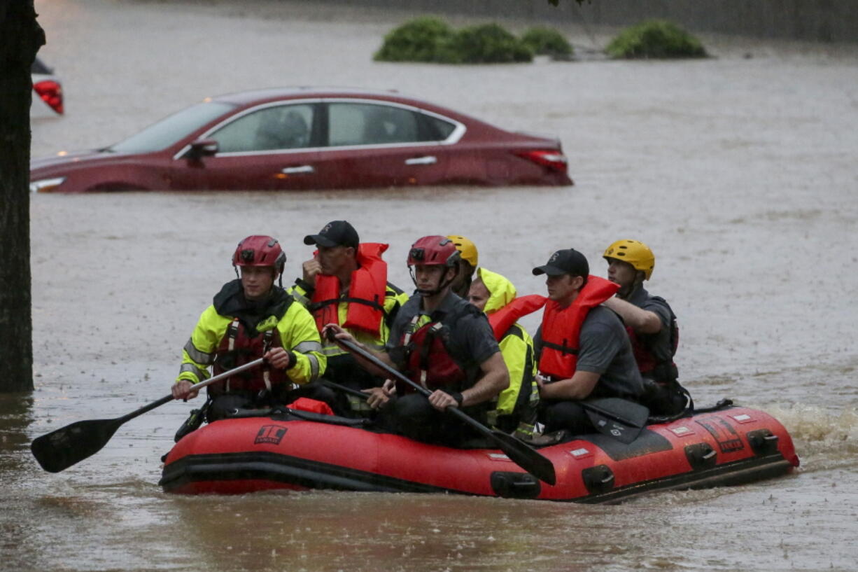 Residents of the Crescent at Lakeshore apartment complex are rescued by Homewood Fire and Rescue as severe weather produced torrential rainfall flooding several apartment buildings Tuesday, May 4, 2021 in Homewood, Ala.