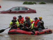 Residents of the Crescent at Lakeshore apartment complex are rescued by Homewood Fire and Rescue as severe weather produced torrential rainfall flooding several apartment buildings Tuesday, May 4, 2021 in Homewood, Ala.