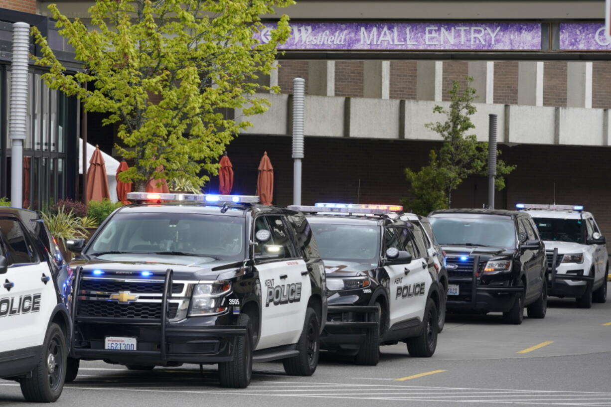 Police vehicles respond to a reported shooting, Saturday, May 1, 2021, at Southcenter Mall in Tukwila, Wash., south of Seattle. (AP Photo/Ted S.