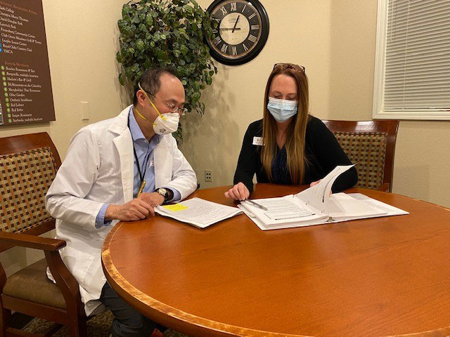 Tomo Honda NP reviewing care plans with Glenwood Place’s Director of Nursing, Kristen Buckner RN