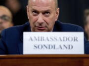 FILE - In this Nov. 20, 2019 file photo, then Ambassador Gordon Sondland, U.S. Ambassador to the European Union, center, appears before the House Intelligence Committee on Capitol Hill in Washington. The Trump administration's ambassador to the European Union and a pivotal witness in 2019 impeachment proceedings has sued former Secretary of State Mike Pompeo in an effort to recoup $1.8 million in legal fees.