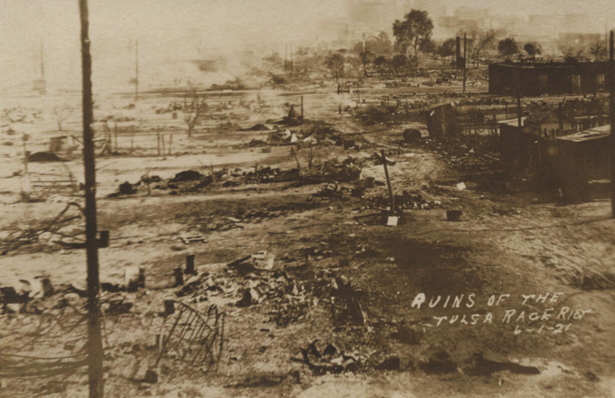 This photo provided by the Department of Special Collections, McFarlin Library, The University of Tulsa shows the ruins of Dunbar Elementary School and the Masonic Hall in the aftermath of the June 1, 1921, Tulsa Race Massacre in Tulsa, Okla.