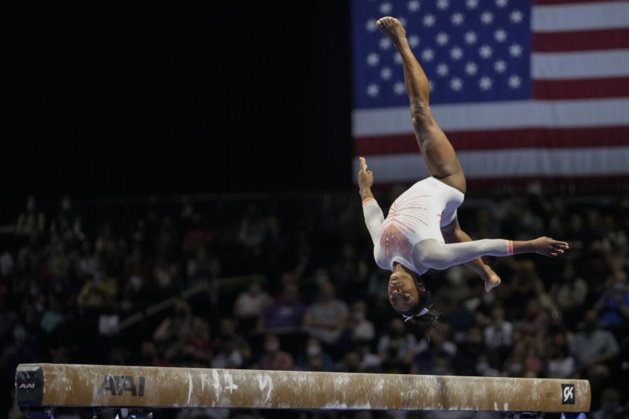 Simone Biles performs her balance beam routine during the U.S. Classic gymnastics competition in Indianapolis, Saturday, May 22, 2021.