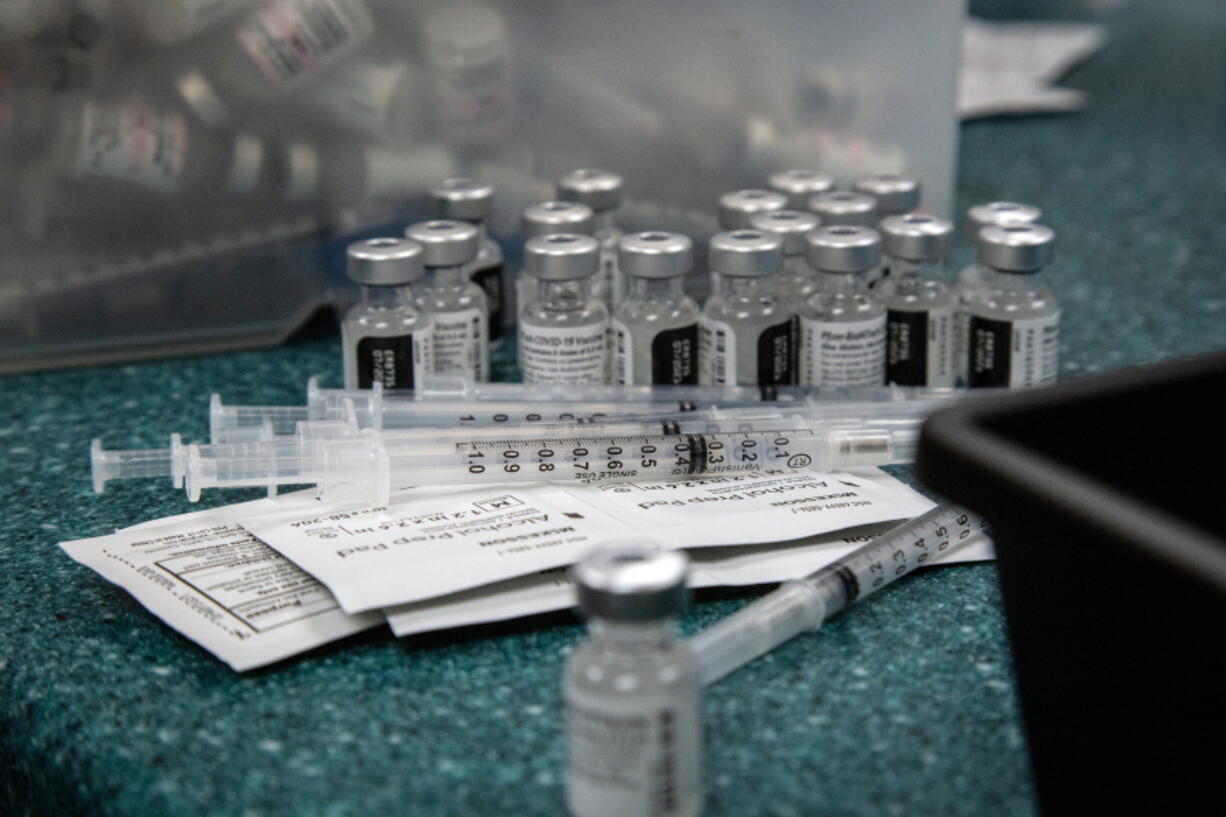 Doses of the Pfizer coronavirus vaccine are seen being prepared on Wednesday, May 12, 2021, in Decatur, Ga. Hundreds of children, ages 12 to 15, received the Pfizer vaccine at the DeKalb Pediatric Center, just days after it was approved for use within their age group.