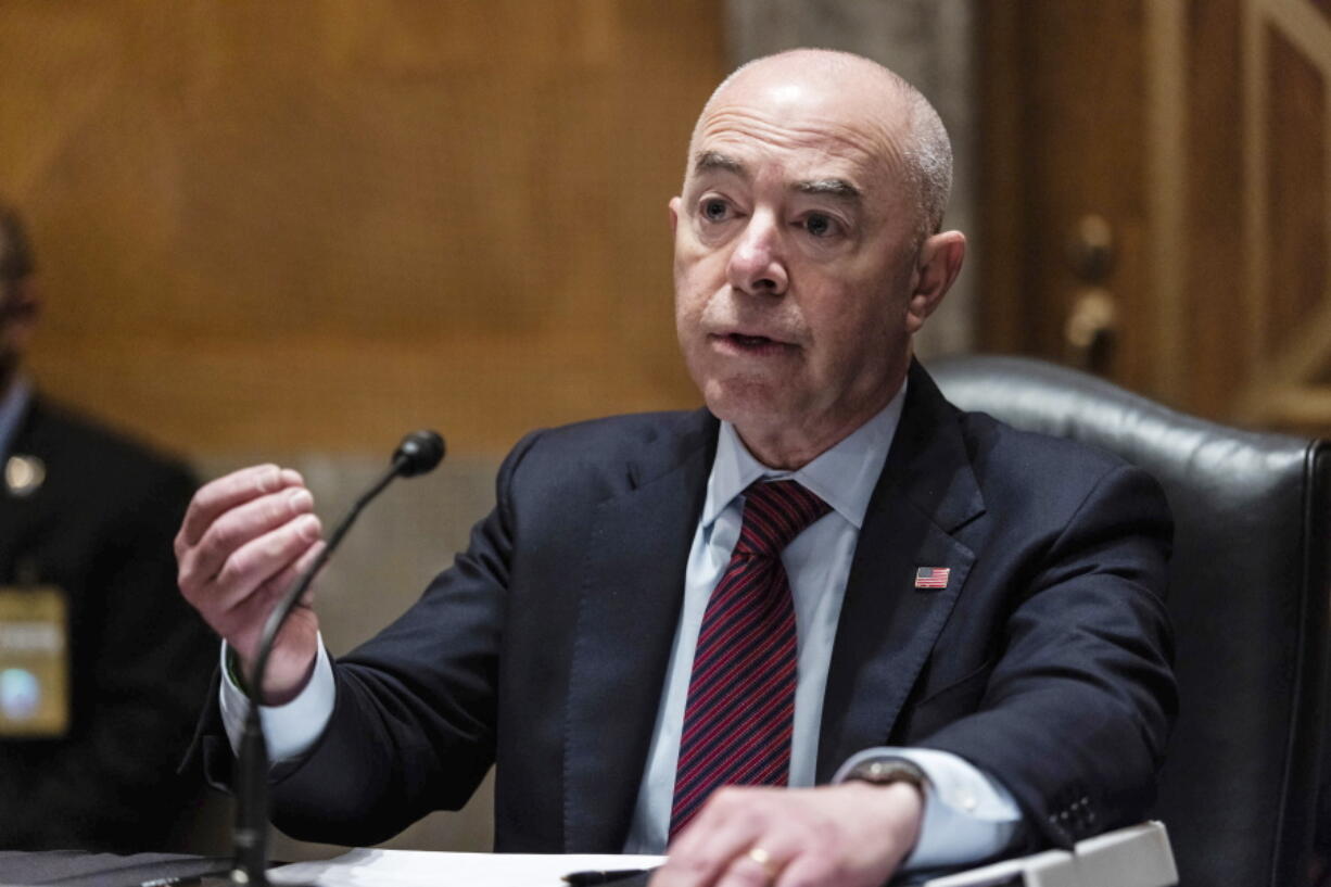 FILE - In this  Thursday, May 13, 2021 file photo, Homeland Security Secretary Alejandro Mayorkas testifies before a Senate Homeland Security and Government Affairs Committee hearing on Capitol Hill, in Washington. The Biden administration is allowing eligible Haitian nationals residing in the U.S. to apply for a new 18-month designation for temporary protected status, reversing a Trump administration effort that had sought to end the special consideration.