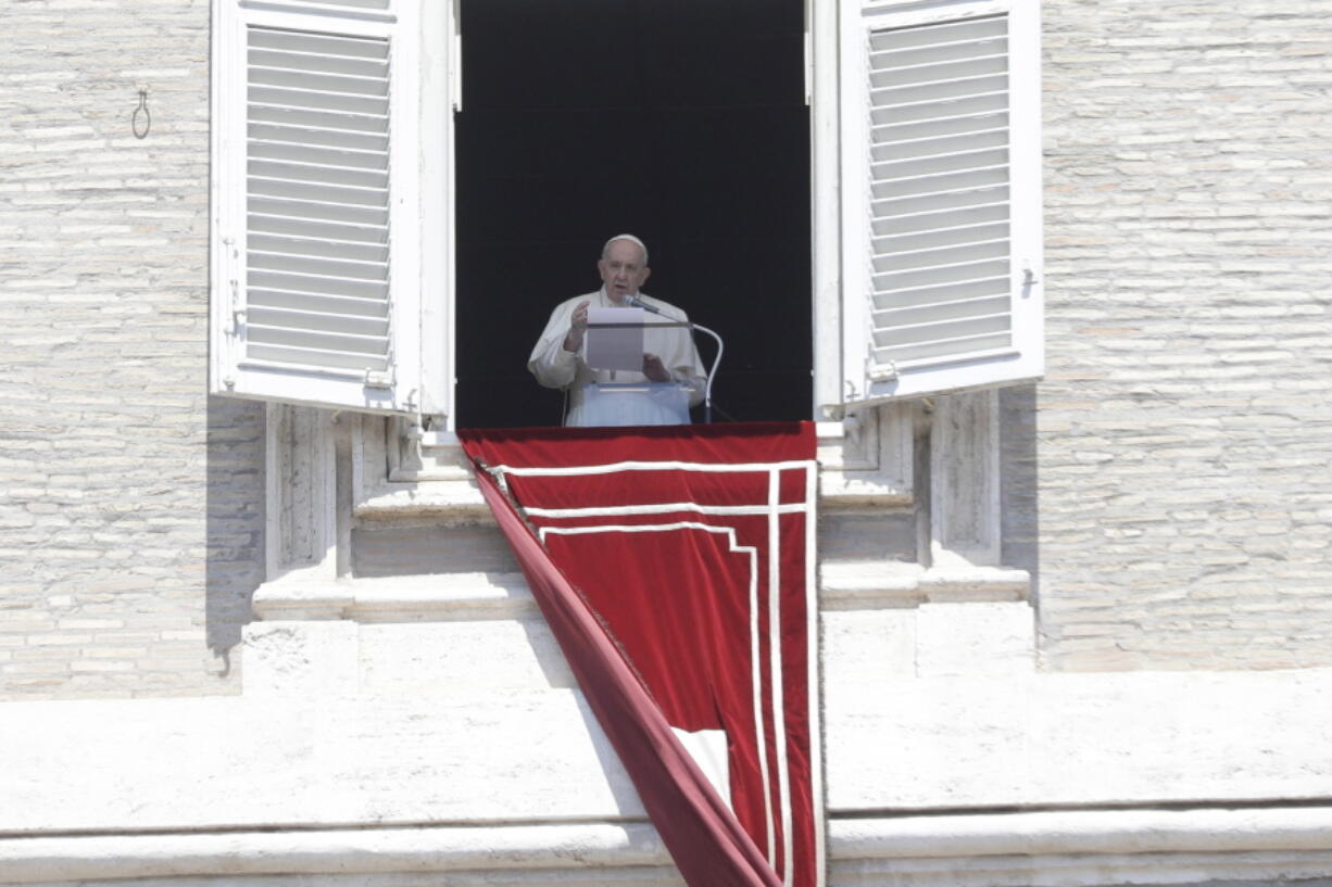 Pope Francis recites the Angelus noon prayer in St. Peter's Square at the Vatican, Sunday, May 9, 2021.