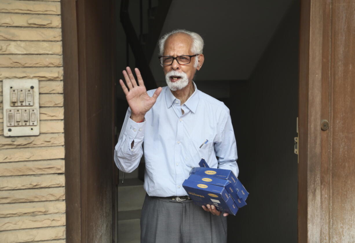 FILE - In this Nov. 8, 2020, file photo, Vice President Kamala Harris' maternal uncle, Balachandran Gopalan, talks to media outside his house, in New Delhi, India.