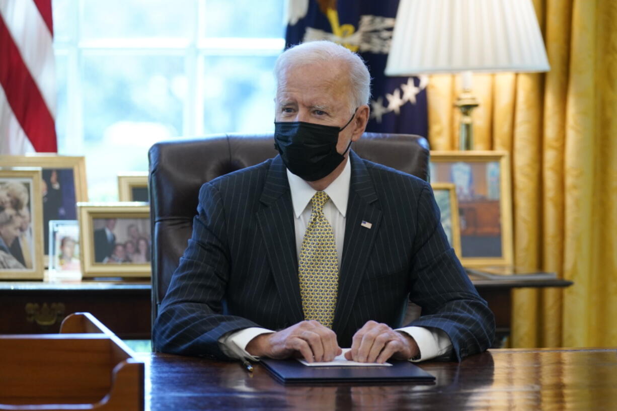 FILE - In this March 30, 2021 file photo, President Joe Biden speaks after signing the PPP Extension Act of 2021, in the Oval Office of the White House in Washington.  The government's key COVID-19 relief program for small businesses has run out of money. The Small Business Administration said Wednesday, May 5,  that the Paycheck Protection Program has been exhausted. As of Sunday, the PPP had given out nearly 10.8 million loans worth more than $780 billion since April of last year.