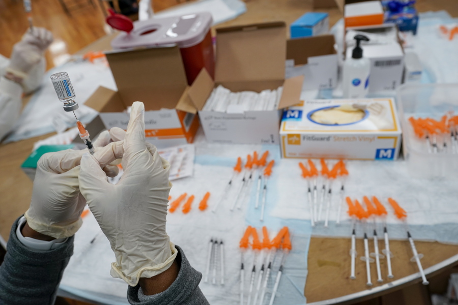 FILE - In this April 8, 2021, file photo, a Northwell Health registered nurses fills a syringe with the Johnson & Johnson COVID-19 vaccine at a pop up vaccination site at the Albanian Islamic Cultural Center in the Staten Island borough of New York. The Biden administration on Wednesday, May 5,  joined calls for more sharing of the technology behind COVID-19 vaccines to help speed the end of the pandemic, a shift that puts the U.S. alongside many in the developing world who want rich countries to do more to get doses to the needy.