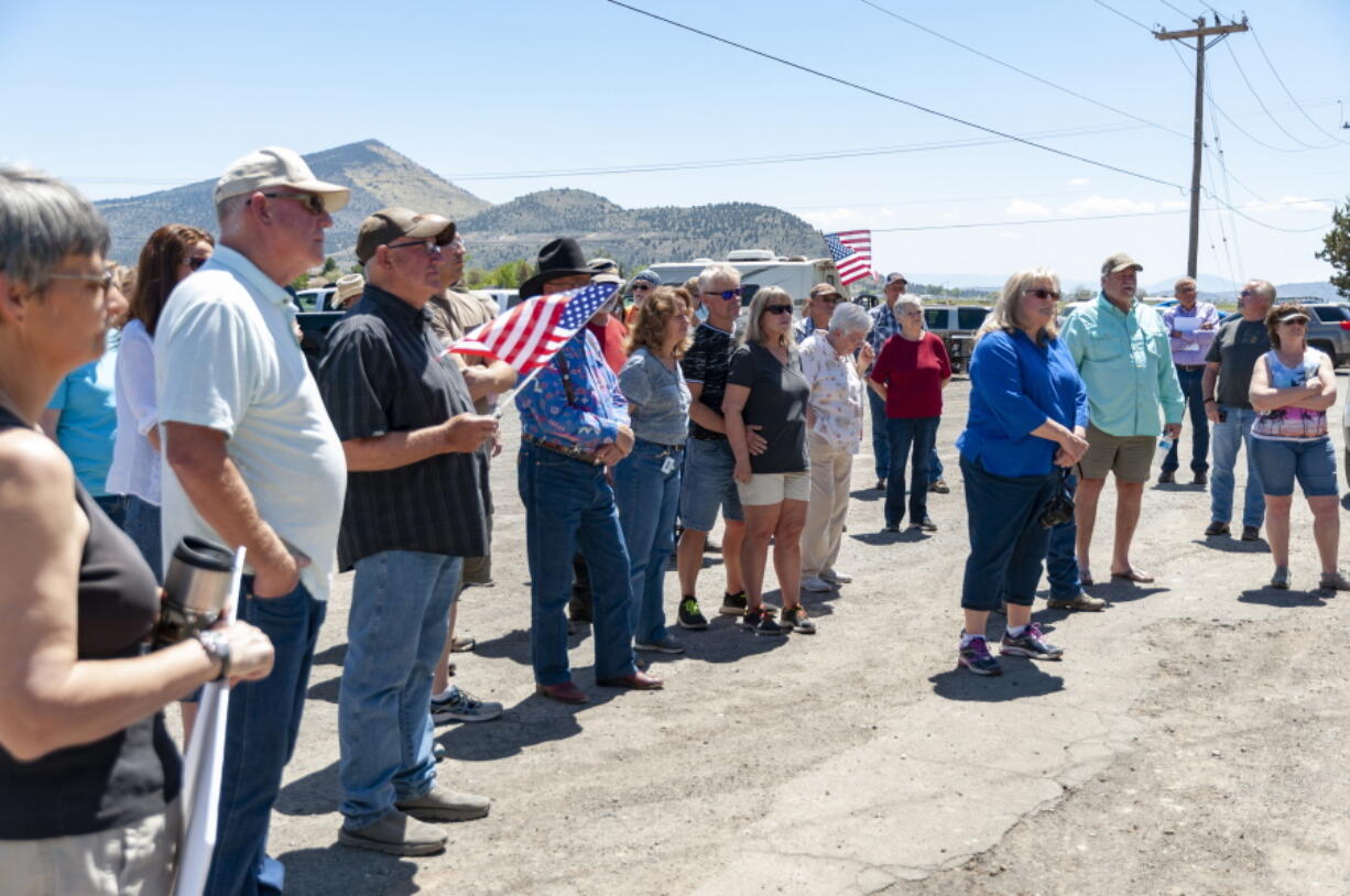 A group of roughly 30 people affiliated with People's Rights Oregon gathered at Klamath Irrigation District headquarters in Klamath Falls, Ore., on Thursday, May 13, 2021, to protest after federal regulators shut off irrigation water to farmers from a critical reservoir due to drought conditions.