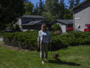 Carol Porter outside of her former home that she lived in for 25 years in Issaquah on May 17, 2021. Porter lost her home when she filed for bankruptcy in 2015 because the Washington Law that was meant to prevent this from happening had not kept up with rising home prices. A new law aims to keep people in their homes if they file for bankruptcy, raising the protected amount to better match King County’s medium home price.