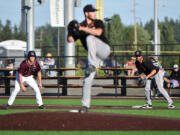 Ridgefield outfielder Caden Connor, left, eyes Cowlitz pitcher Mark Woinarowicz on Wednesday, June 2, 2021, during the Ridgefield Raptors' 10-8 loss to the Cowlitz Black Bears at the Ridgefield Outdoor Recreation Complex.