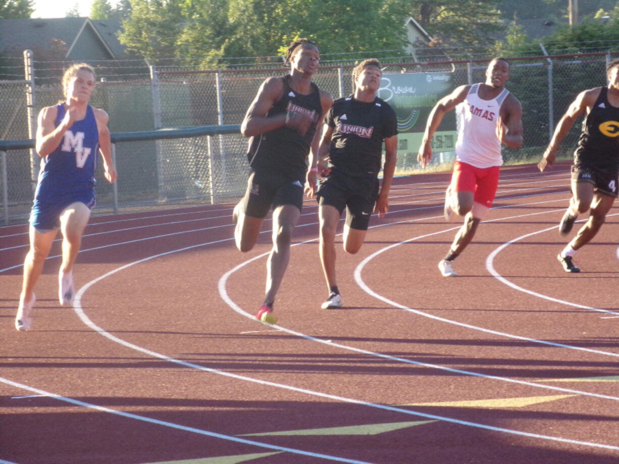 Union's Tobias Merriweather (second from left) races to a win in the boys 200 at the 4A/3A GSHL Invitational track and field meet on Wednesday, June 2, 2021 at McKenzie Stadium (Tim Martinez/The Columbian)