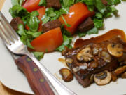 Balsamic-Glazed Steak with Tomato and Watercress Salad (Linda Gassenheimer/TNS)