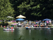 A crowd soaks up the sunshine on the shores of Battle Ground Lake on Saturday at Battle Ground Lake State Park.