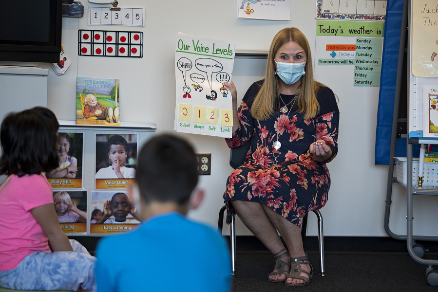 Kindergarten teacher Pam Younkin guides students on the appropriate voice levels for the classroom at Sifton Elementary School in September. Evergreen will expand summer school offerings to students in all grades, including 1,800 elementary students signed up for June and August summer school.