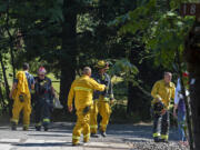 Firefighters respond to a two-alarm fire at a large house on Evergreen Highway.on Monday afternoon, June 28, 2021.