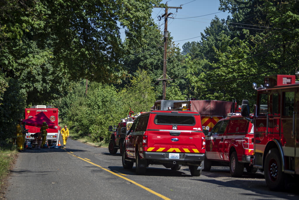 Firefighters respond to a two-alarm fire at a large house on Evergreen Highway.on Monday afternoon, June 28, 2021.