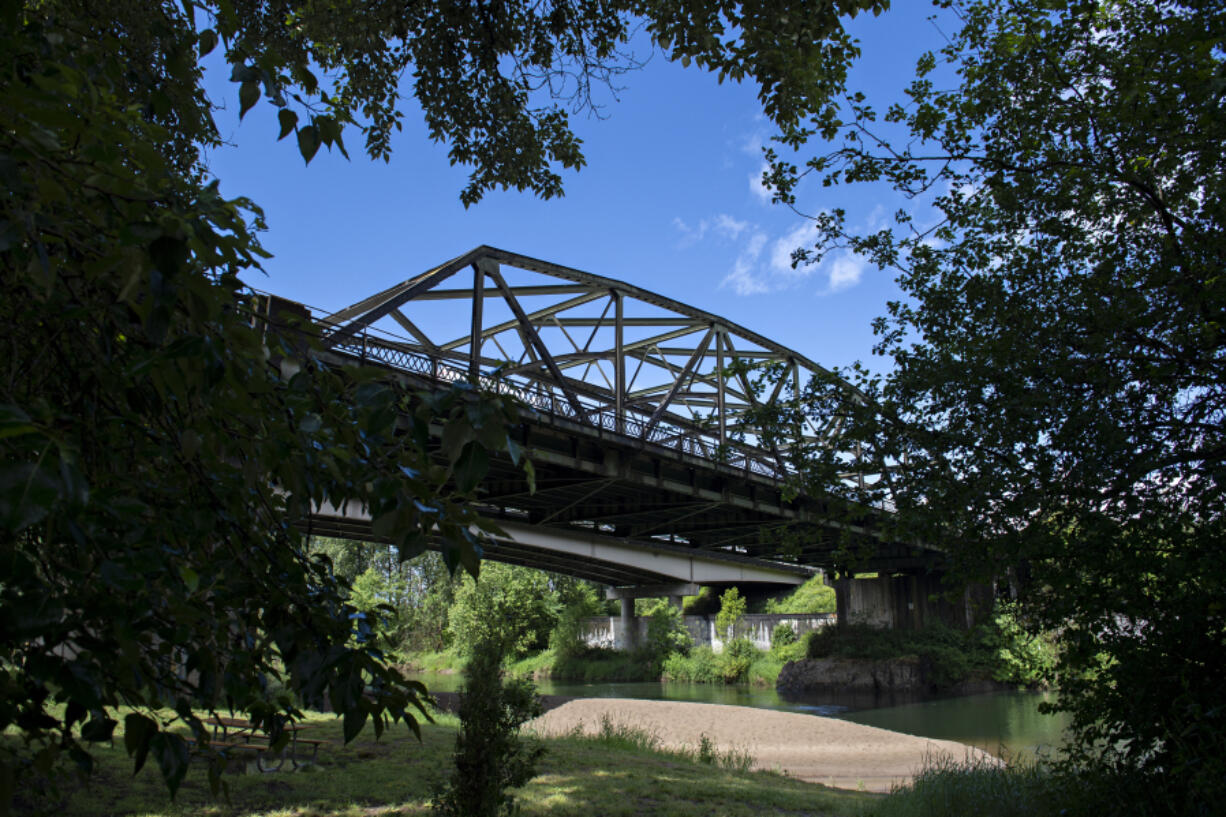 The northbound lanes of Interstate 5 stretch over the East Fork Lewis River at Paradise Point State Park.