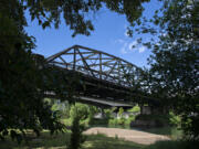 The northbound lanes of Interstate 5 stretch over the East Fork Lewis River at Paradise Point State Park.