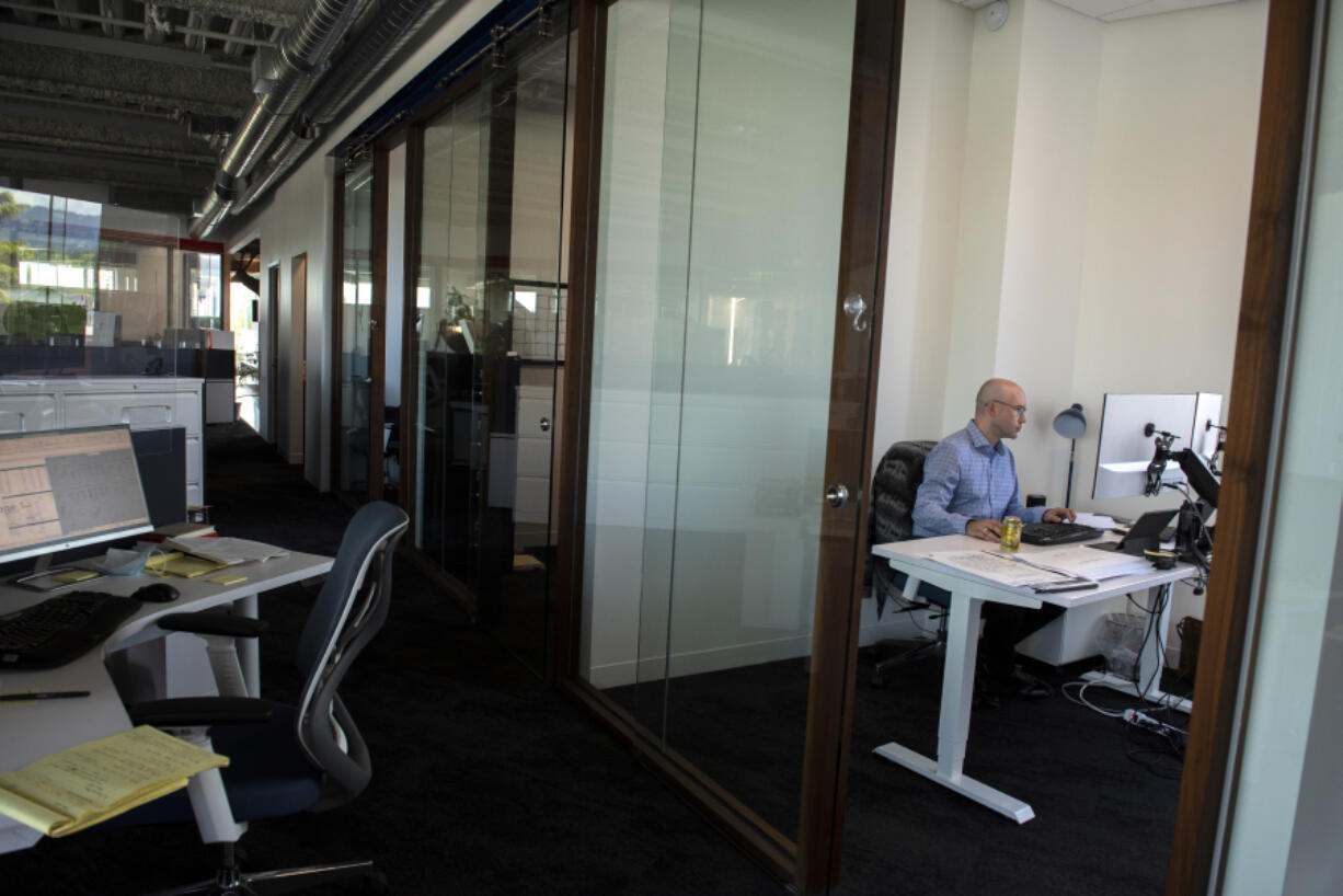 Vladimir Rakach, senior construction manager for Hurley Development, works in his office at Hurley Tower in downtown Vancouver.