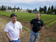 Scott Beaudoin, left, and Mike Beaudoin talk about the future of strawberries at Joe's Place Farms. Although the farm store is no longer open, the brothers are carrying on with a U-pick operation.