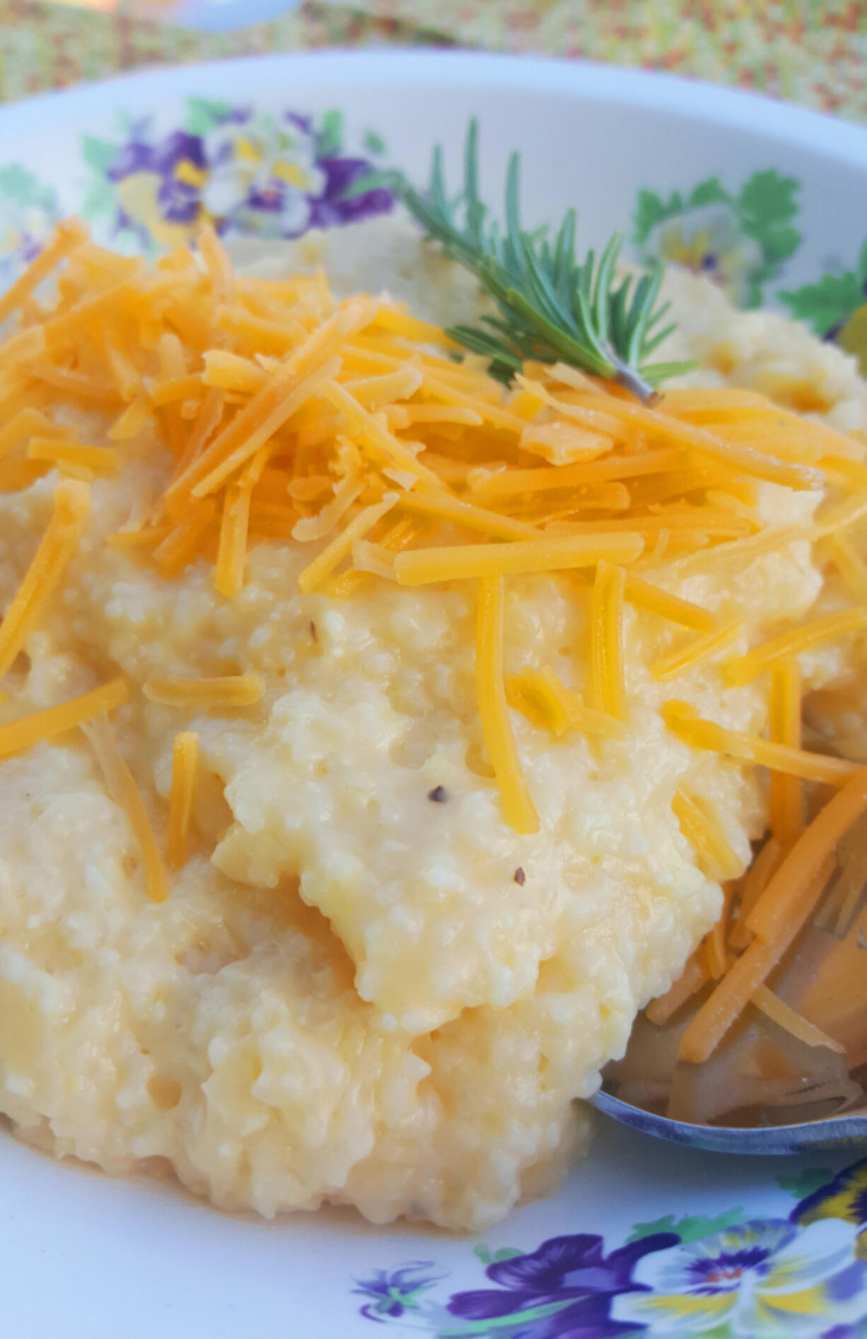 Cheesy grits are exactly as advertised: grits boiled in chicken stock then mixed with butter, cream and two cups of cheese.