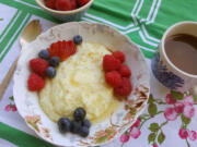 Cooked with milk, butter and honey, sweet grits are a hearty breakfast with fresh berries and a sprinkle of cinnamon.