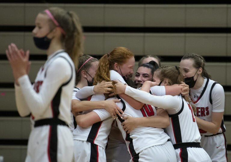 Camas players celebrate late as the starters are pulled in a dominating victory in the 4A/3A District Championship game on Friday, June 4, 2021, at The Warehouse in Camas. Camas won 77-38.