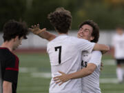 Camas senior Ethan Jud, facing, gives Hayden Rouse a hug after Rouse scored the final goal in the Papermakers’ 6-0 rout of Union on Thursday, June 3, at Union High School. The Papermakers sealed the 4A/3A Greater St.