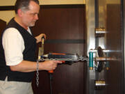 Dave McOmie, professional safecracker and your Camas neighbor, doing his thing on a typical workday.