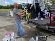 RIDGEFIELD: The Police Activities League of Southwest Washington partnered with Waste Connections to give 21 local children a bike and helmet for the start of summer.