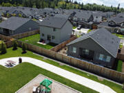 A children's playground and homes are pictured in a neighborhood in northeast Battle Ground on Wednesday morning. Infrastructure is at the top of the list of the city's draft housing action plan.