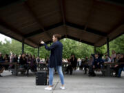 Sen. Ann Rivers, center, takes a question from the crowd as she discusses children and COVID-19 masks at Felida Park on Thursday. Rivers, R-La Center, met with constituents to talk about masks, social distancing and virus testing in schools.