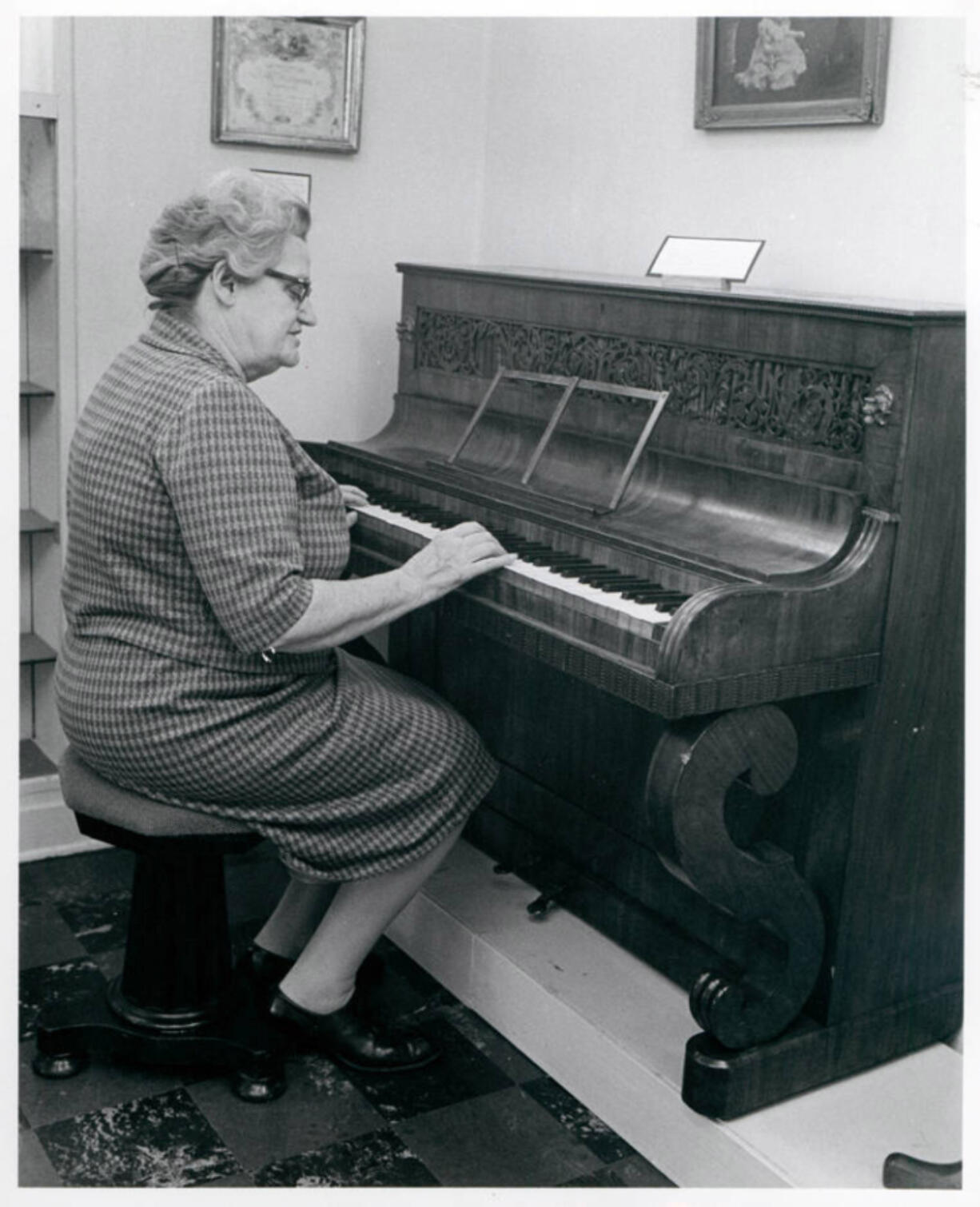 Stella Granewald shows off the Covington piano's six octaves (one short of modern pianos) as she performs on the 19th-century instrument during a Clark County Historical Museum open house in May 1967. Earlier that year, Nan Rice donated the piano to the museum. The old piano is on display at the museum, although it will need considerable restoration before anyone hears its voice again.