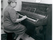 Stella Granewald shows off the Covington piano's six octaves (one short of modern pianos) as she performs on the 19th-century instrument during a Clark County Historical Museum open house in May 1967. Earlier that year, Nan Rice donated the piano to the museum. The old piano is on display at the museum, although it will need considerable restoration before anyone hears its voice again.