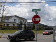 Cars navigate the intersection of South Royle Road and South Wells Drive in Ridgefield on Tuesday.