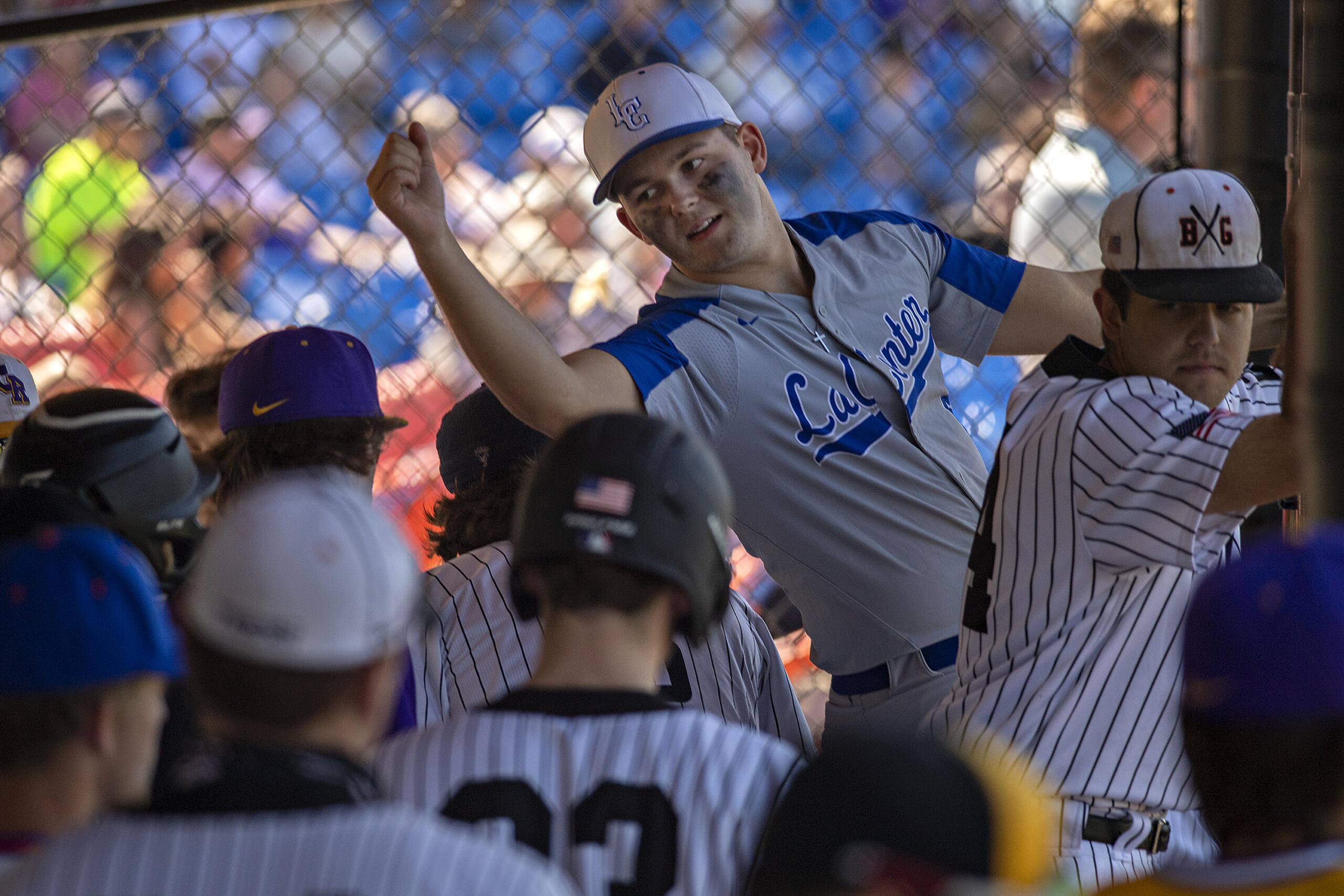 La Center's Tom Lambert, facing, stretches to congratulate an American League teammate after they scored in the first inning during the Senior All-Star Game at Ridgefield Outdoor Recreation Center on Wednesday afternoon, June 16, 2021.